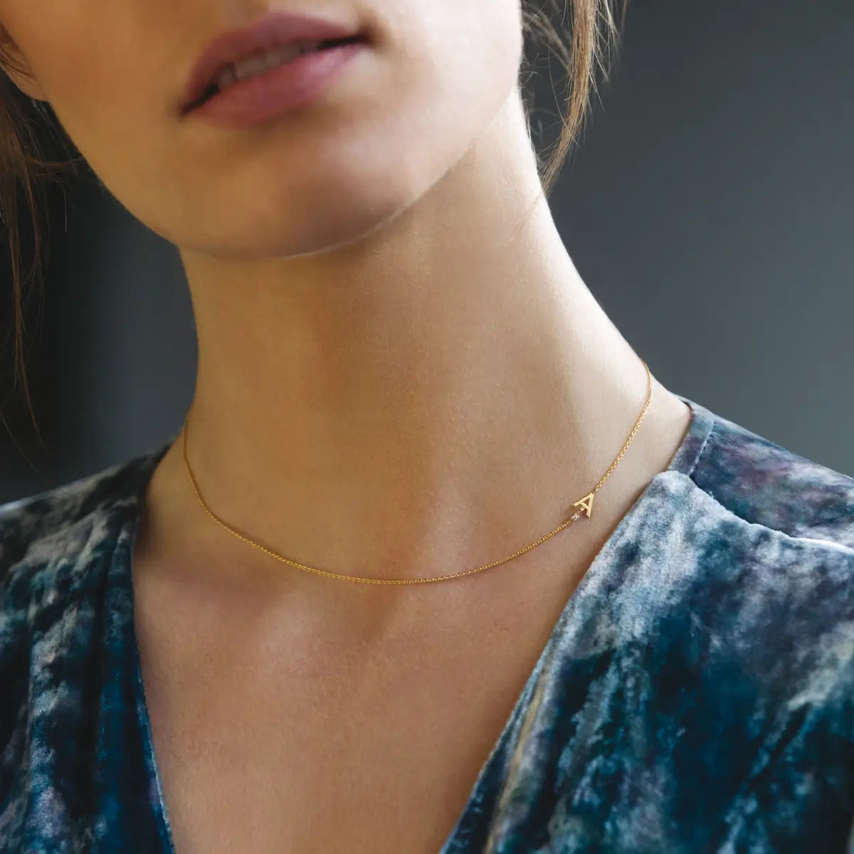 White gold necklace with letter and diamond